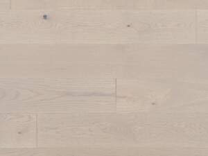 The White Oak Snowdrift Character Brushed flooring by Mirage Floors, part of the Flair Collection, epitomizes the natural grace and character of wood.