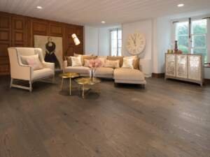 The White Oak Sailing Stone Character Brushed flooring from Mirage Floors' Flair Collection encapsulates the innate elegance and character of wood