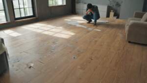 Flooring fails 2025 - person looking on ruined flooring