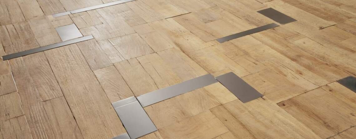 light color mix of hardwood and metal inlays flooring trend 2025