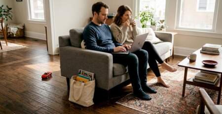 Homeowners relaxing on wide plank hardwood floor
