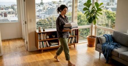 Homeowner in Bay Area living room with hardwood floors