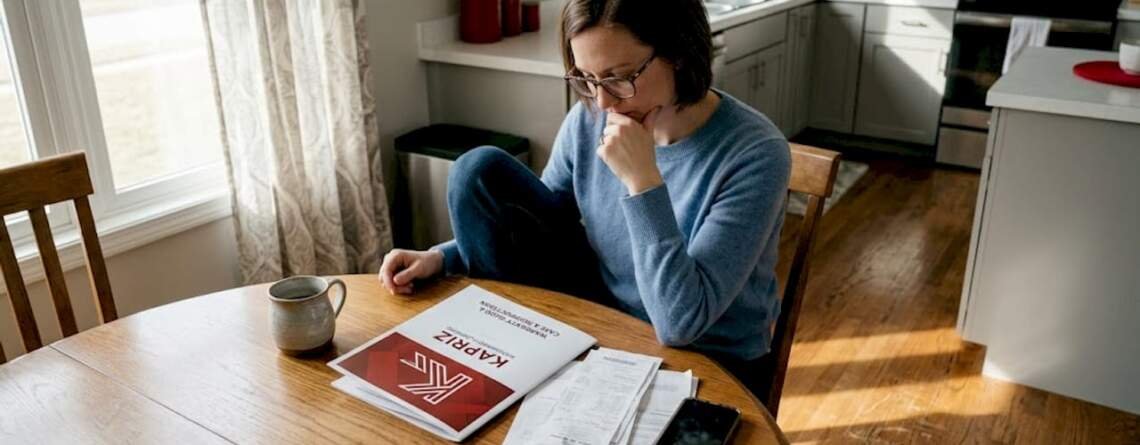 Homeowner reviewing hardwood flooring warranty documents