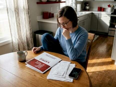 Homeowner reviewing hardwood flooring warranty documents