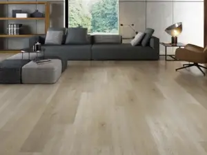 Athena eSPC flooring in a restrained living room, light brown softened by a gentle taupe note.