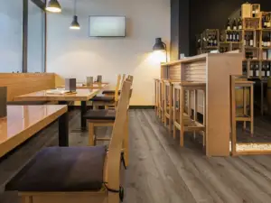 Copano Oak COREtec Pro Classics SPC installed in dining nook — medium taupe-brown, grounded and warm — Redwood City