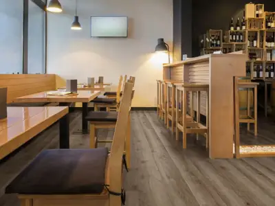 Copano Oak COREtec Pro Classics SPC installed in dining nook — medium taupe-brown, grounded and warm — Redwood City