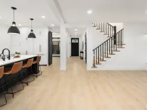 Cygnus Vellichor Galaxy SPC installed in open-plan great room — warm neutral beige, sophisticated light tone — Cupertino