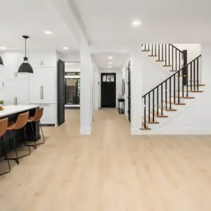 Cygnus Vellichor Galaxy SPC installed in open-plan great room — warm neutral beige, sophisticated light tone — Cupertino