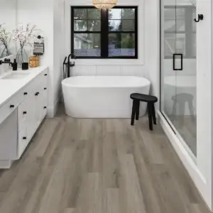 Elliptical Oak COREtec Pro Classics SPC installed in bathroom — warm grey-beige with subtle depth — Pleasanton