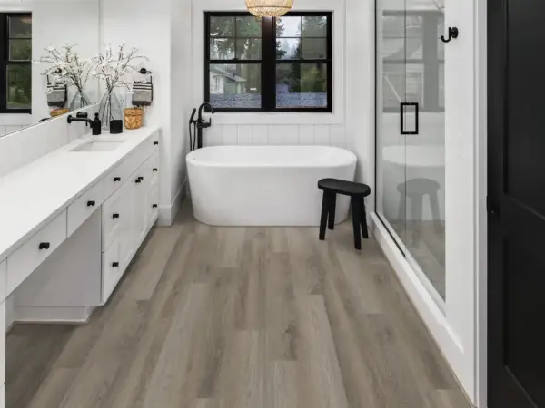 Elliptical Oak COREtec Pro Classics SPC installed in bathroom — warm grey-beige with subtle depth — Pleasanton