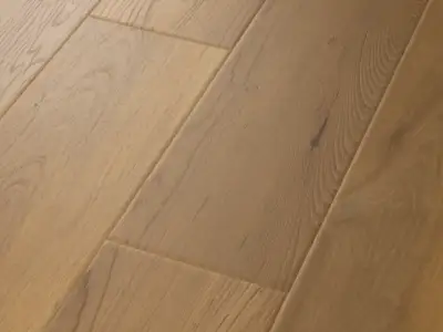 Essex Maple COREtec Pro Premium close-up — scattered small dark knots on 6mm waterproof SPC with 20 mil wear layer