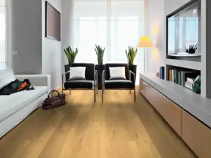Essex Maple COREtec Pro Premium SPC installed in living room — medium warm brown, naturally mottled — Newark