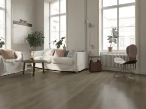 Lark Paradigm Flooring Performer PLUS SPC installed in modern Scandinavian living room — soft grey-brown — Saratoga