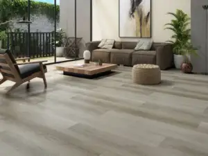 Picchi eSPC flooring in an open living room, warm-leaning grey-taupe, muted.