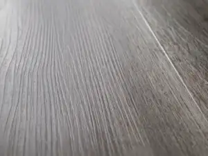 Close-up of River Shoal's weathered deep grey cooled toward charcoal wood-grain texture.
