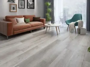 Torre eSPC flooring in a nordic living room, lightly warm pale grey, neutral and clean.