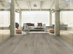 Triumph Paradigm Flooring Conquest 20MIL SPC installed in industrial loft living room — greige-grey — San Carlos